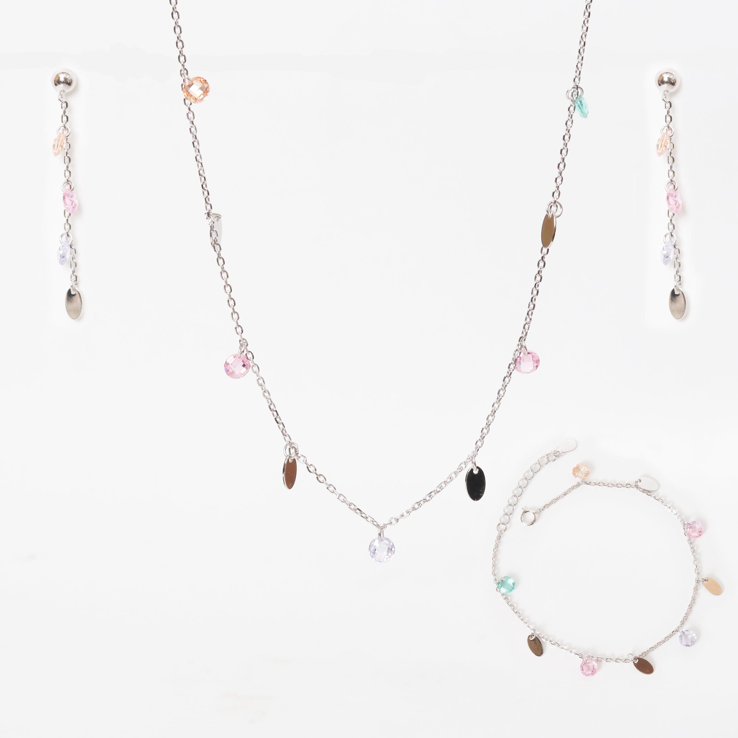 Silver-tone necklace with small heart charms and matching bracelet plus dangling earrings.