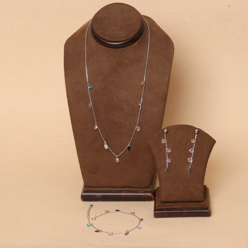 Sterling silver jewelry set: layered necklace, bracelet, and dangling earrings with colorful stones.