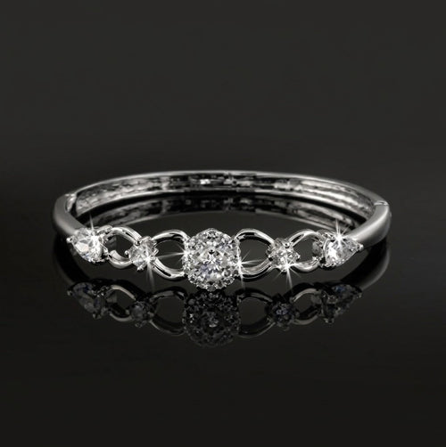 Sterling silver layered bangle with clear crystal stones and sparkling pave details